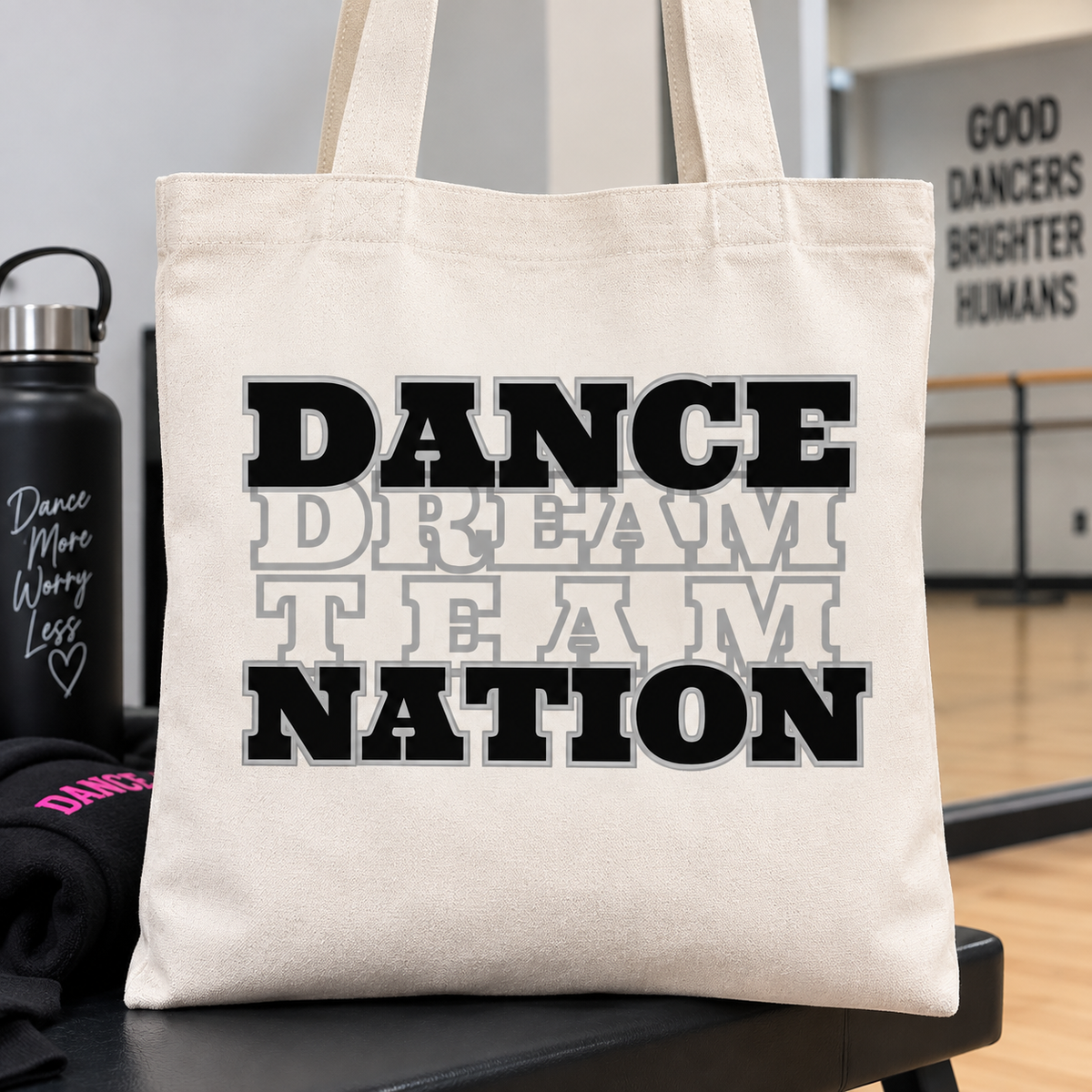 Natural canvas tote bag with black and grey stacked Dance Nation design