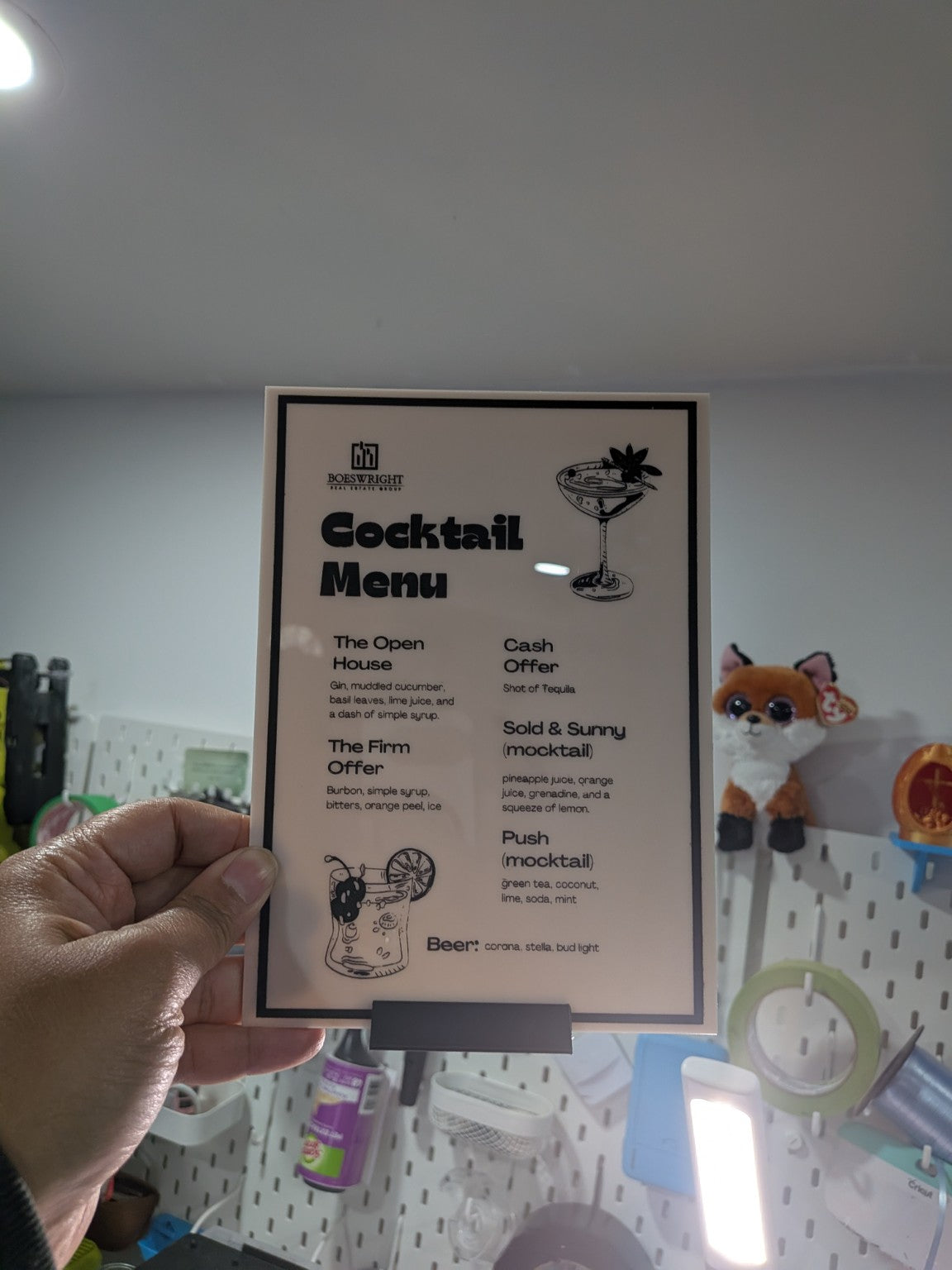 Custom cocktail menu sign by Designs By Diza displayed in a freestanding frame