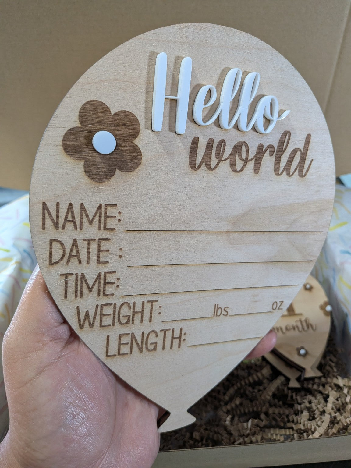 Wooden balloon Hello World birth announcement sign with engraved birth detail fields and raised white lettering