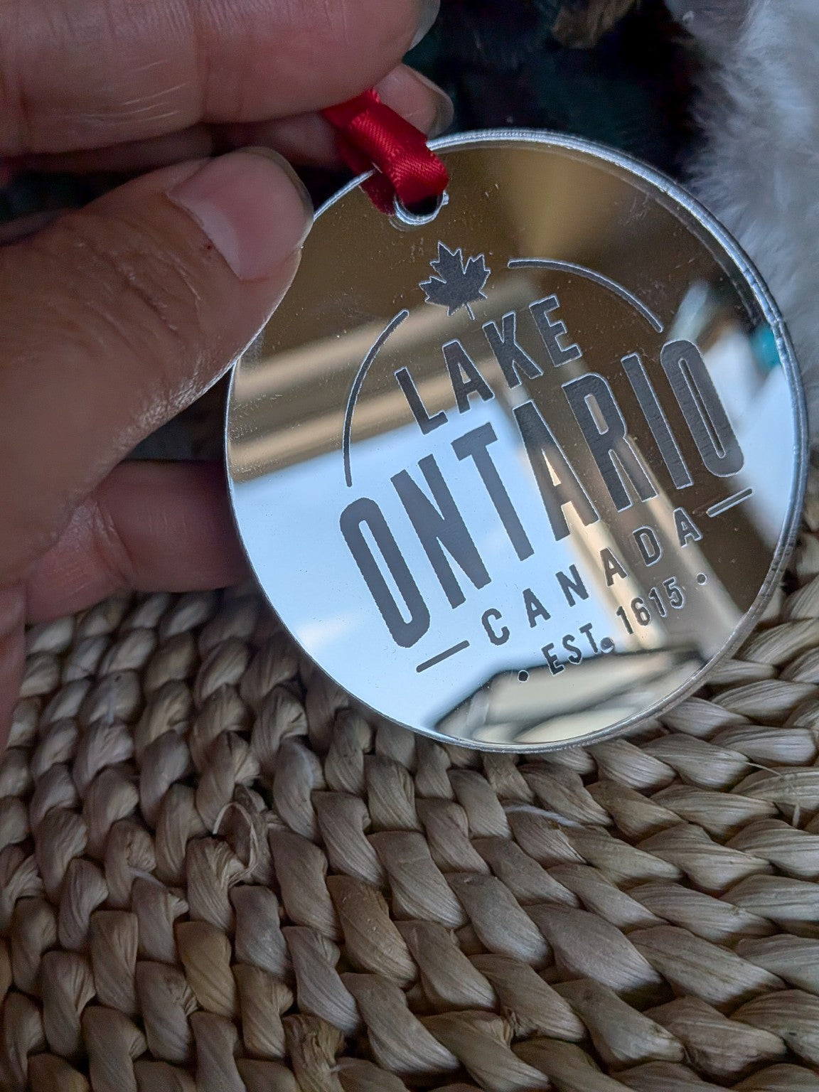 Close-up of Lake Ontario Canada engraved silver mirror acrylic Christmas ornament