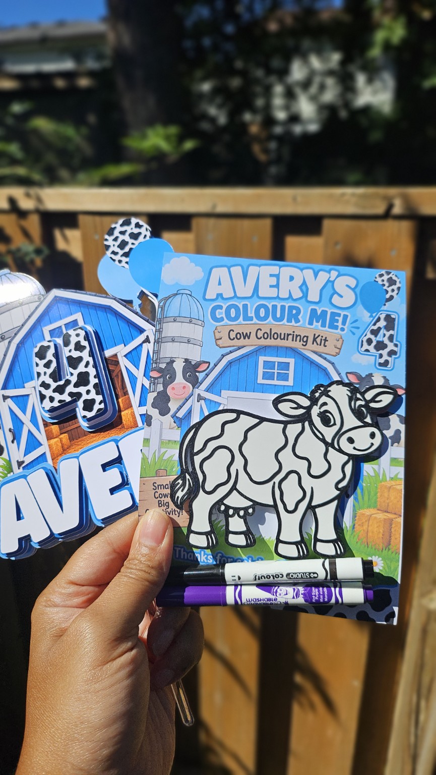 Close up of personalized cow colouring kit with blue farm theme, custom name and age