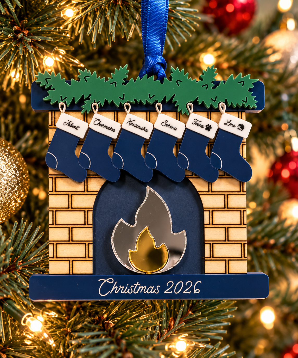 Personalized navy fireplace family Christmas ornament hanging on a Christmas tree